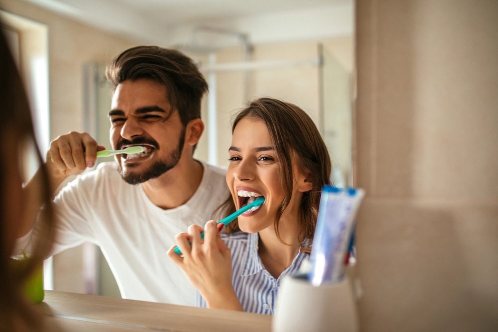 People brushing their teeth